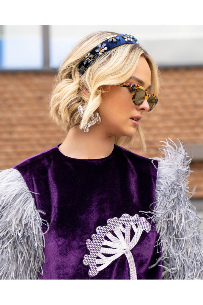 Purple velvet short dress with grey full feathered mid length sleeve and flower embellished front - Image 3