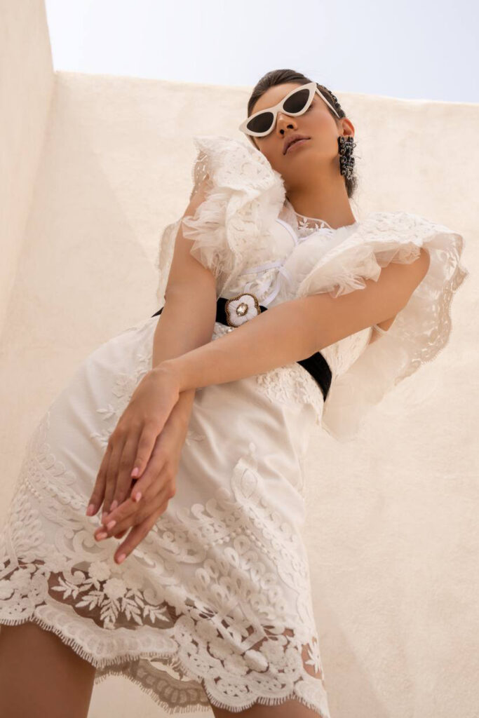 Short lace cocktail dress with ruffled lace shoulder sleeves. Black detailed belt - Image 3
