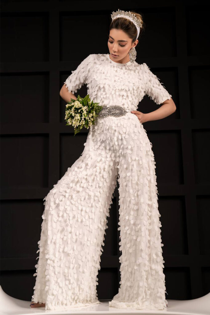 Exclusively hand made fabric white jumpsuit wide legged trousers and short sleeves - Image 3