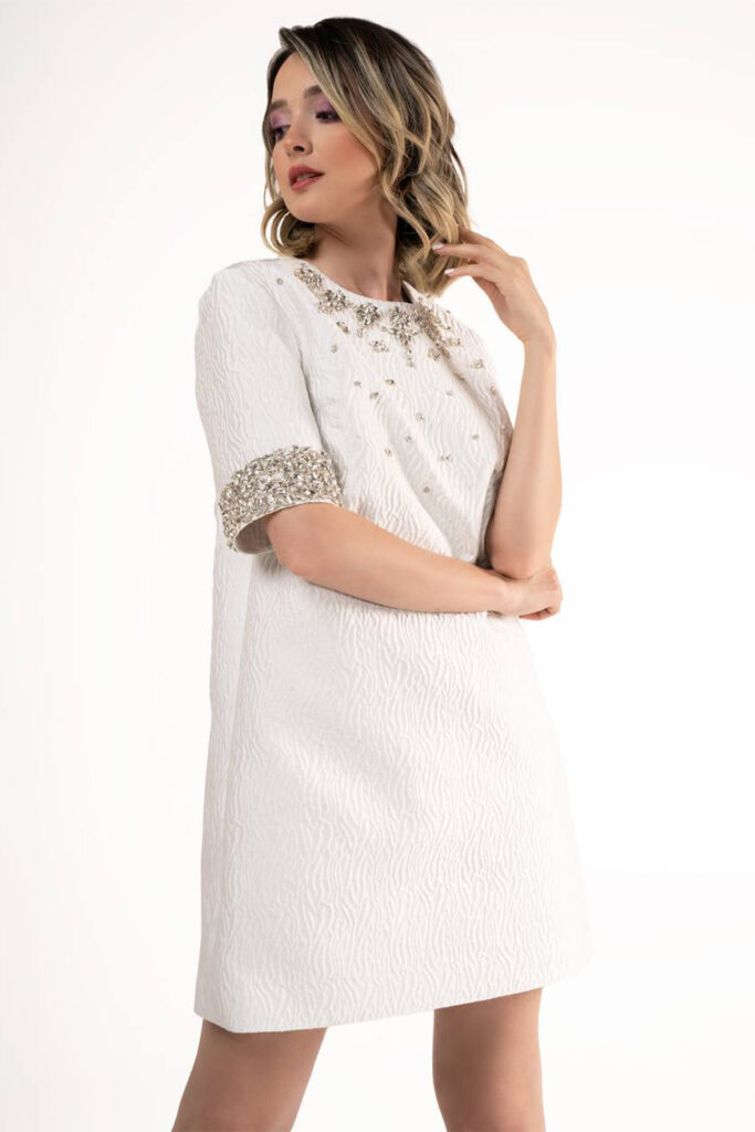 White short elbow length mini dress in white- detailed stone/crystal beading around round neck collar and and sleeves - Image 3