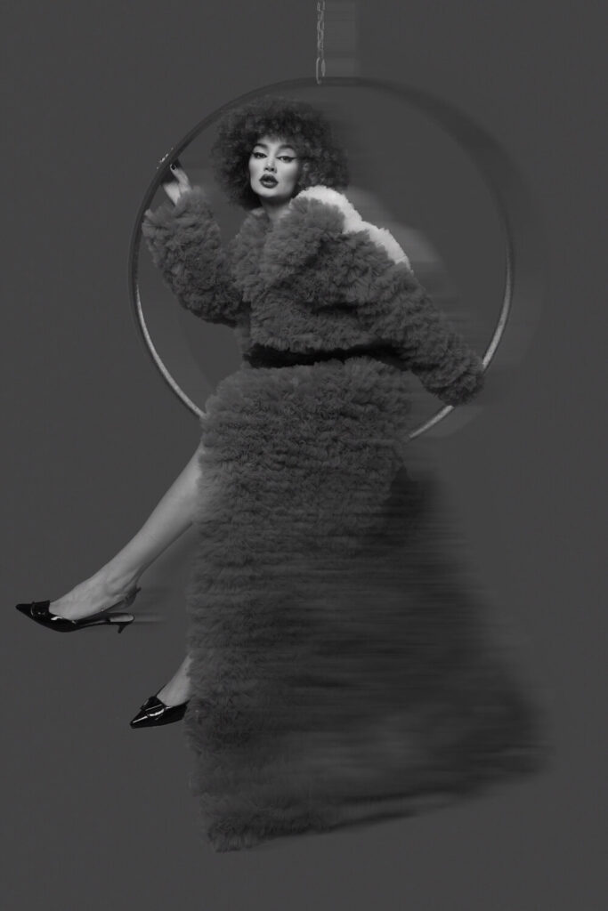 Pleated coat in smoky gray and pearl tones